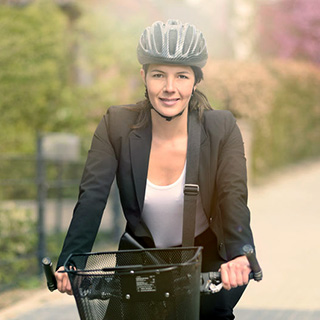 Image of a business woman riding her bike
