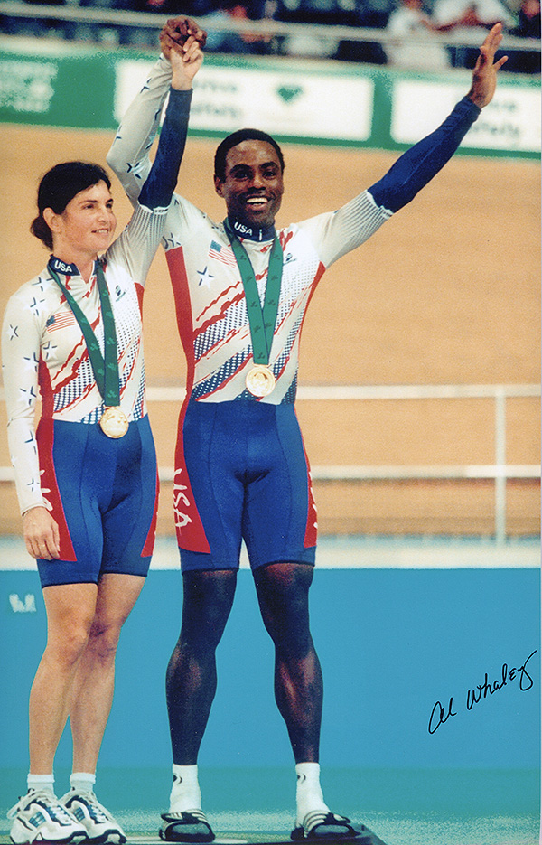Image of Pam Fernandez and Al Whaley receiving a medal in the Paralympic Games